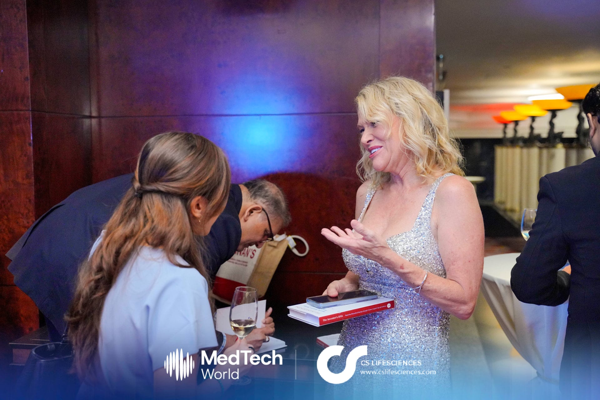 Melissa Espinosa in conversation with attendees at the MedTech World Asia expo reception in Hong Kong
