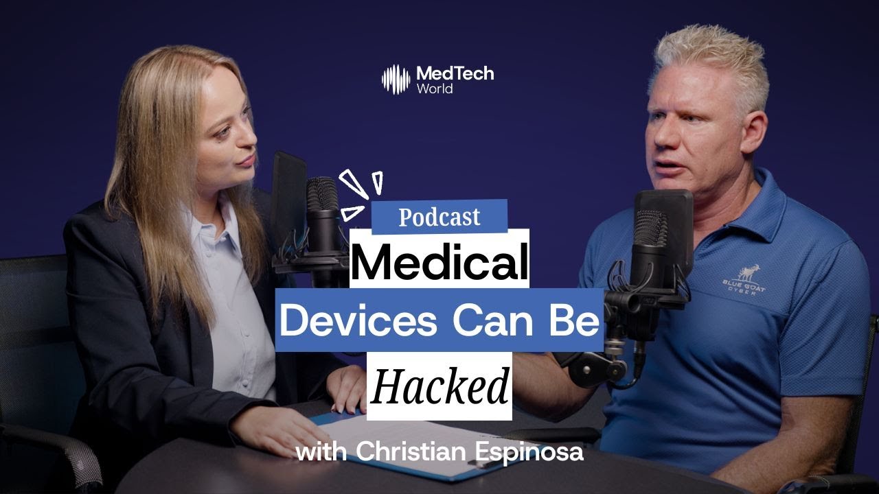 Christian Espinosa in a Blue Goat Cyber polo recording a podcast interview at MedTech World Malta