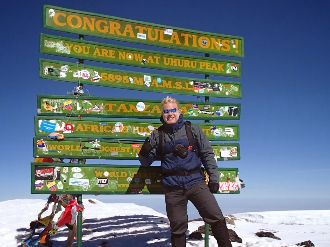 Christian Espinosa at Uhuru Peak, the summit of Mount Kilimanjaro in Tanzania