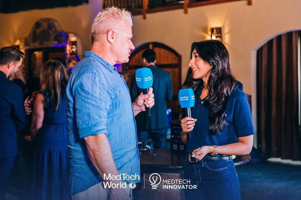 Christian Espinosa giving an on-camera interview at a MedTech industry event
